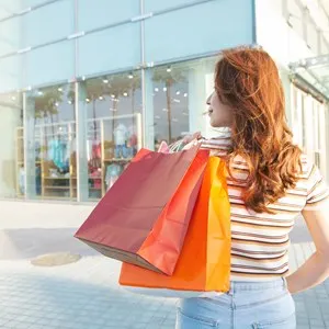 Woman holding shopping bags.