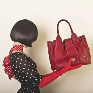 girl in retro clothing with a bag