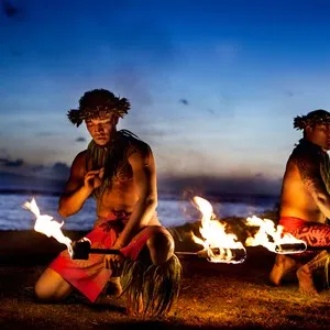 Two Hawaiian Men preparing to Dance with Fire