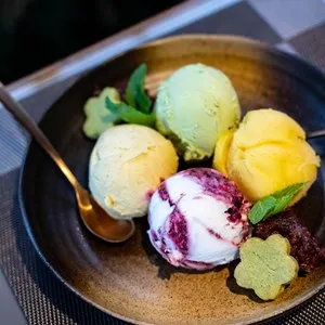four scoops of ice cream on a plate