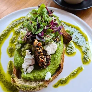 Smashed avocado and feta on toasted sour bread