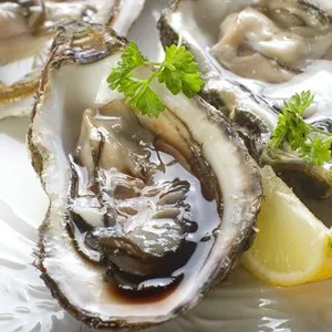 opened oyster on dish