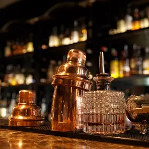 Bartender tools sitting on bar counter