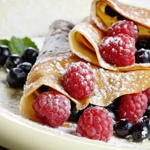 Delicious Tasty Homemade crepes with raspberries