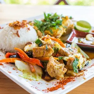 Traditional Balinese cuisine. Vegetable and chicken stir-fry with rice.