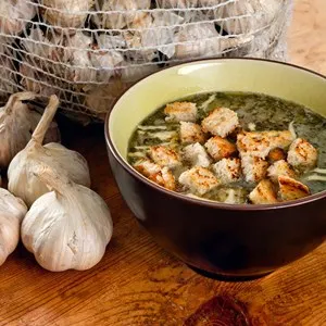 Bowl of a garlic soup with cheese and croutons. Traditional Czech and Slovak dish.