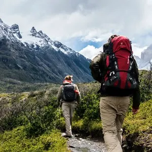 two people hiking in the mountains