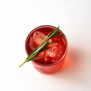 negroni with a sprig of rosemary