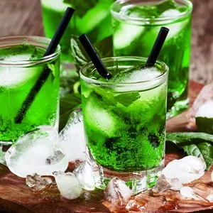 Green cocktail with mint, ice and soda, selective focus