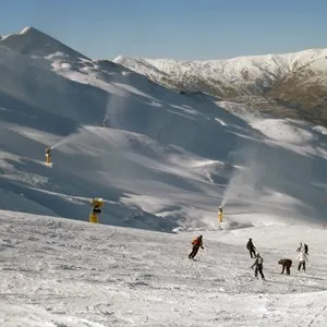 Skiers on New Zealand's Coronet Peak in Queenstown