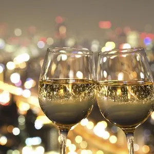 The Night View Of The City Reflected In The Glass Of Wine