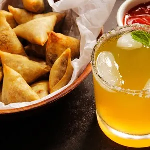 samosa with a cocktail