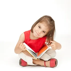 little girl reading a book