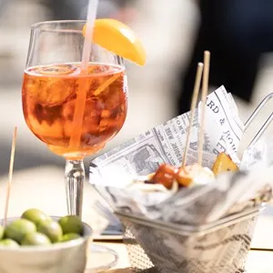 a cocktail and tapas