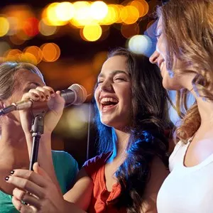 women singing at a karaoke bar