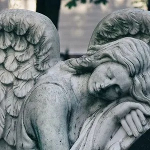female angel statue in a cemetery