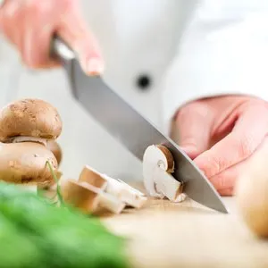 Chef chopping mushrooms