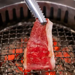 Premium marbled texture wagyu A5 beef steak Japanese restaurant yakiniku grilled on stove meat meal food cooking freshness ingredient barbecue lunch dining buffet fine dining sukiyaki