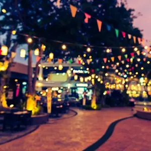 abstract blur image of food stall at night market festival for background usage