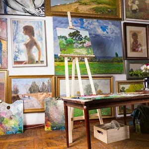 Painters studio with a variety of paintings