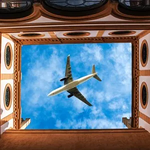 plane flying over the Real Alcazar in Sevilla