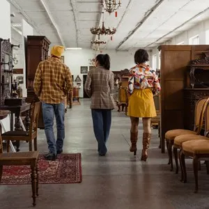 three people in an antique store