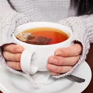 Woman drinking hot tea
