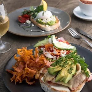 Avocado Smash and Chicken Burger with wine and coffee