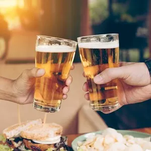 Friends toasting with a glass of beer
