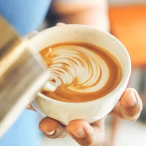 cup of coffee latte on the wood texture