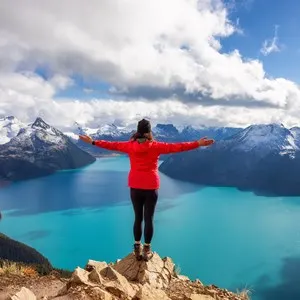 Woman hiking on top of a Canadian mountain. Taken on Panorama Ridge, Garibaldi, Near Whister and Squmish