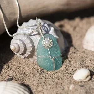 Handmade aqua marine sea glass jewellery, with a silver chain.