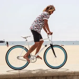 man on a bike by the beach
