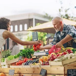 Young Beautiful Customer Shopping for Fresh Natural Vegetables for a Mediterranean Dinner