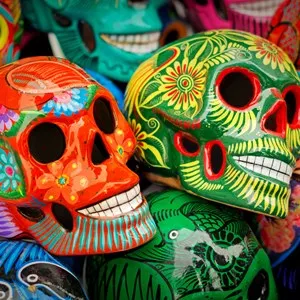 Decorated colorful skulls, ceramics death symbol at market, day of dead, Mexico