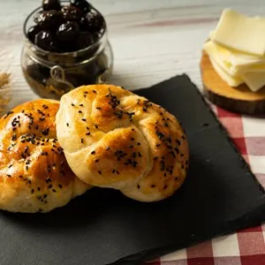 Close up of tasty, delicious, fresh acma with cheese,black olive and tea
