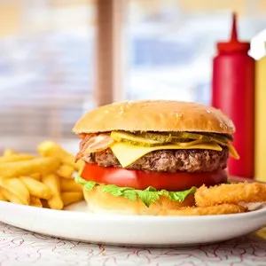 Close up of the fresh hamburger with french fries