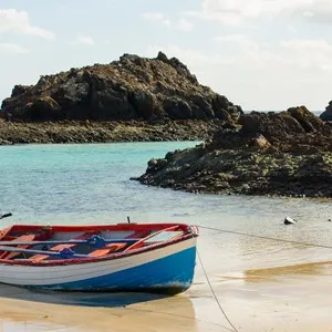 Boat on the edge of the beach, on the Island of Lobos