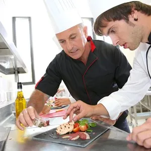 Chef teaching a student