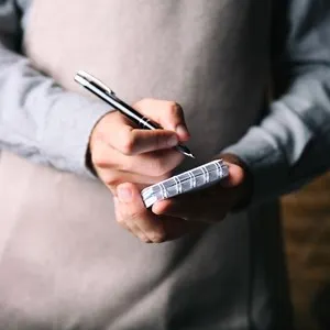 Waiter writing an order