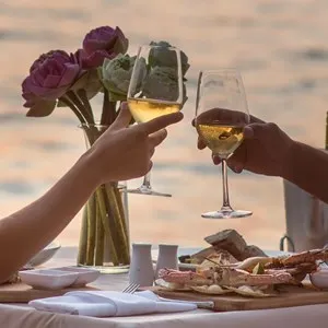 couple having a romantic dinner at a restaurant overlooking the sea