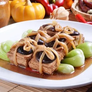 Chinese vegetarian food. fried tofu with mushroom and Chinese mustard