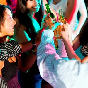 Dance action in a disco club - group of friends,