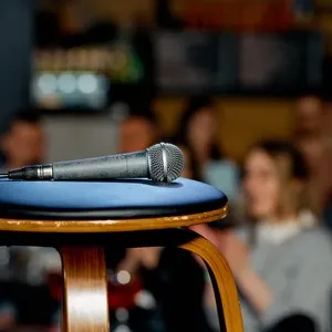 microphone lies on a chair on the stage before the performance