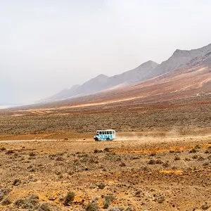 Public Mini-Bus crossing Cofete Beach in Fuerteventura, Canary Islands