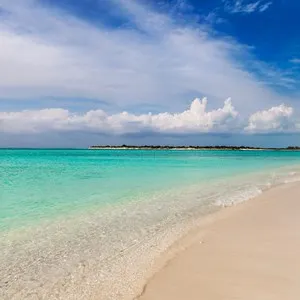 Charter sailboat beached near Leeward Going Through, Providenciales, Turks and Caicos.