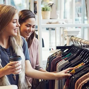 two young women in furs shopping