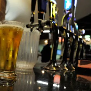 A freshly poured glass of beer sits at a Scottish Pub