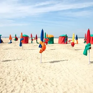 Colorful tents and umbrellas on famous Deauville beach