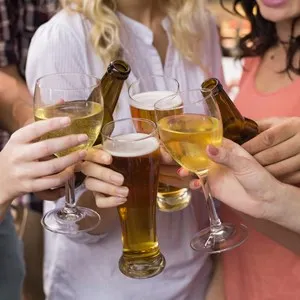 Young friends having a drink together at the bar